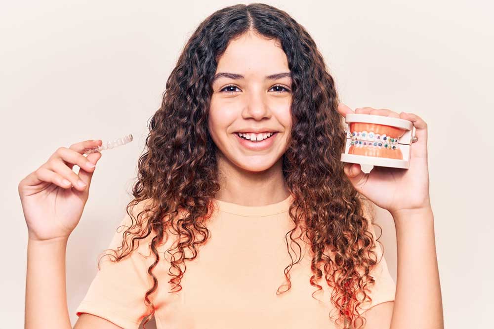 Girl is Hanging a Clear Aligners